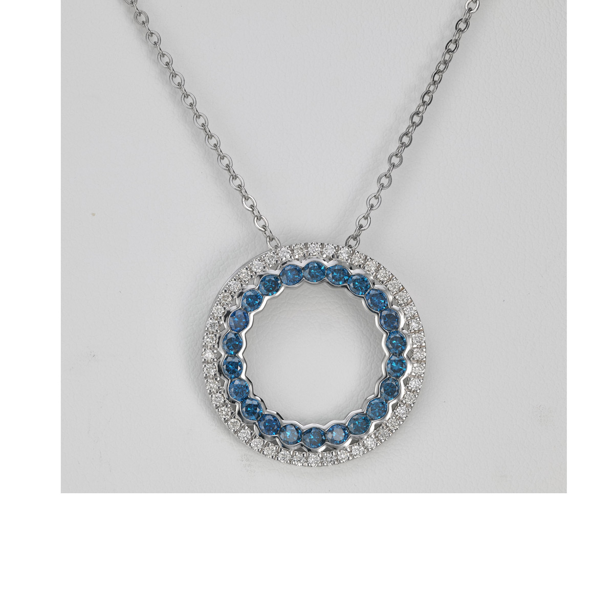 Plain product shot of a blue diamond circle pendant before AI creative jewelry photography